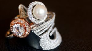 Pearl ring next to diamond ring