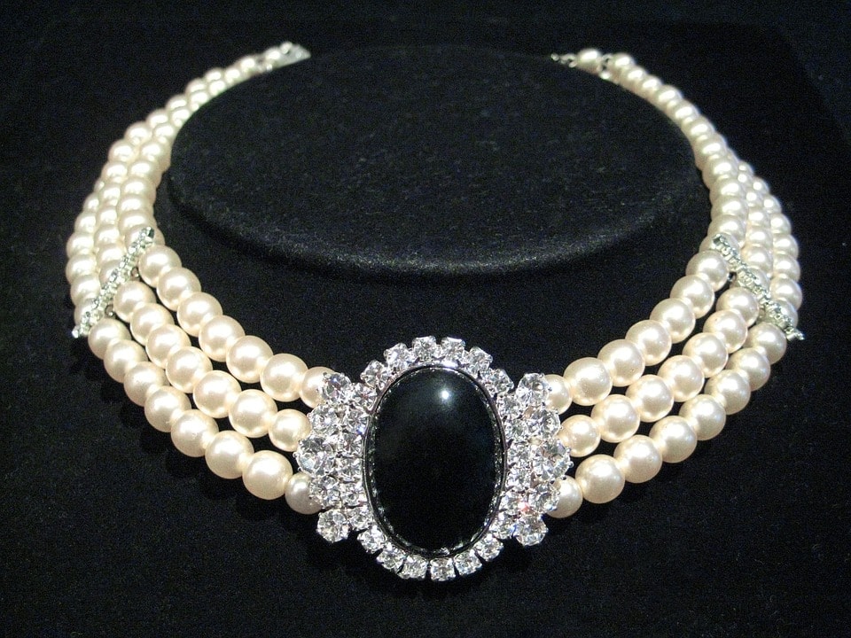 Three strand pearl choker with large black gem