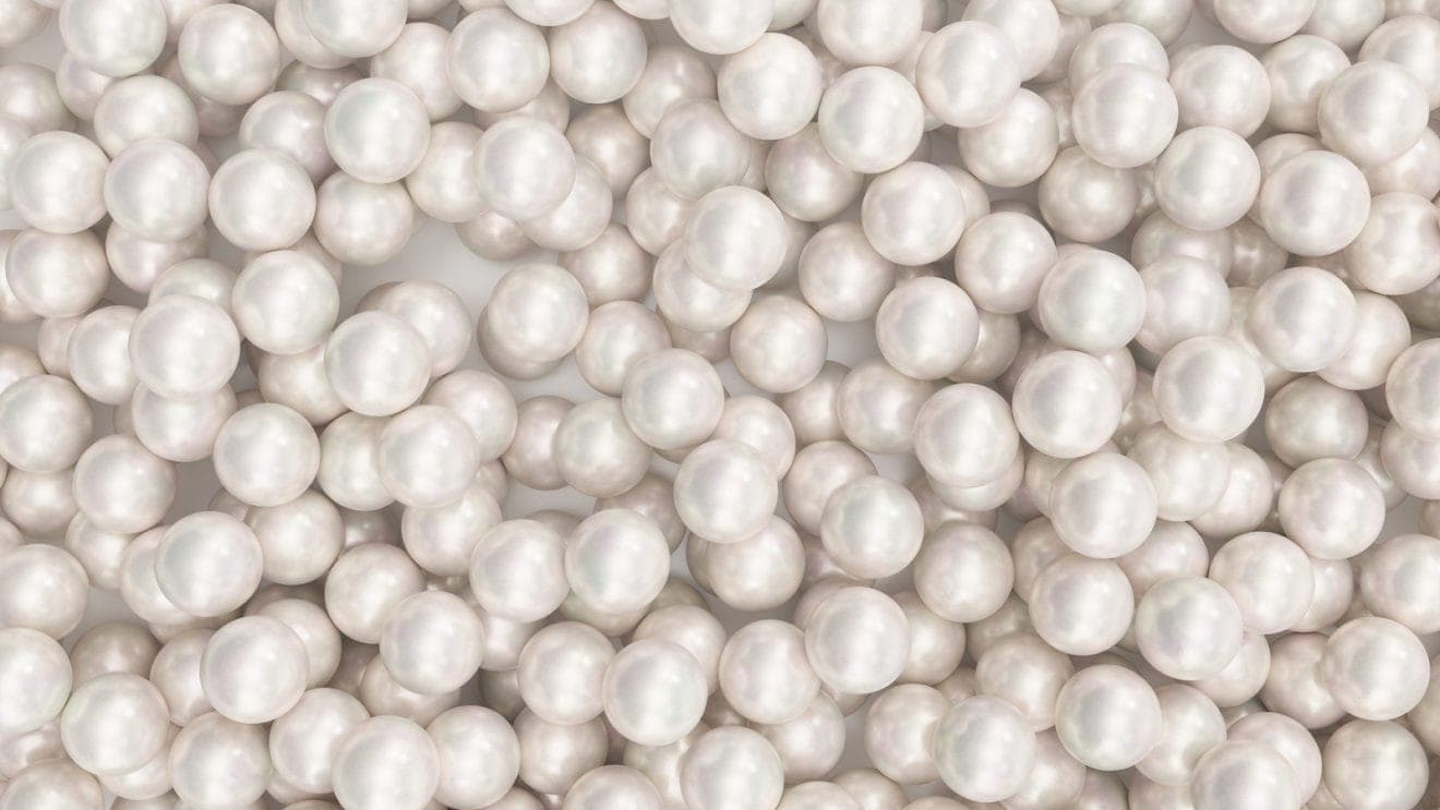 Pile of pearls. Background of the plurality of beautiful pearls.