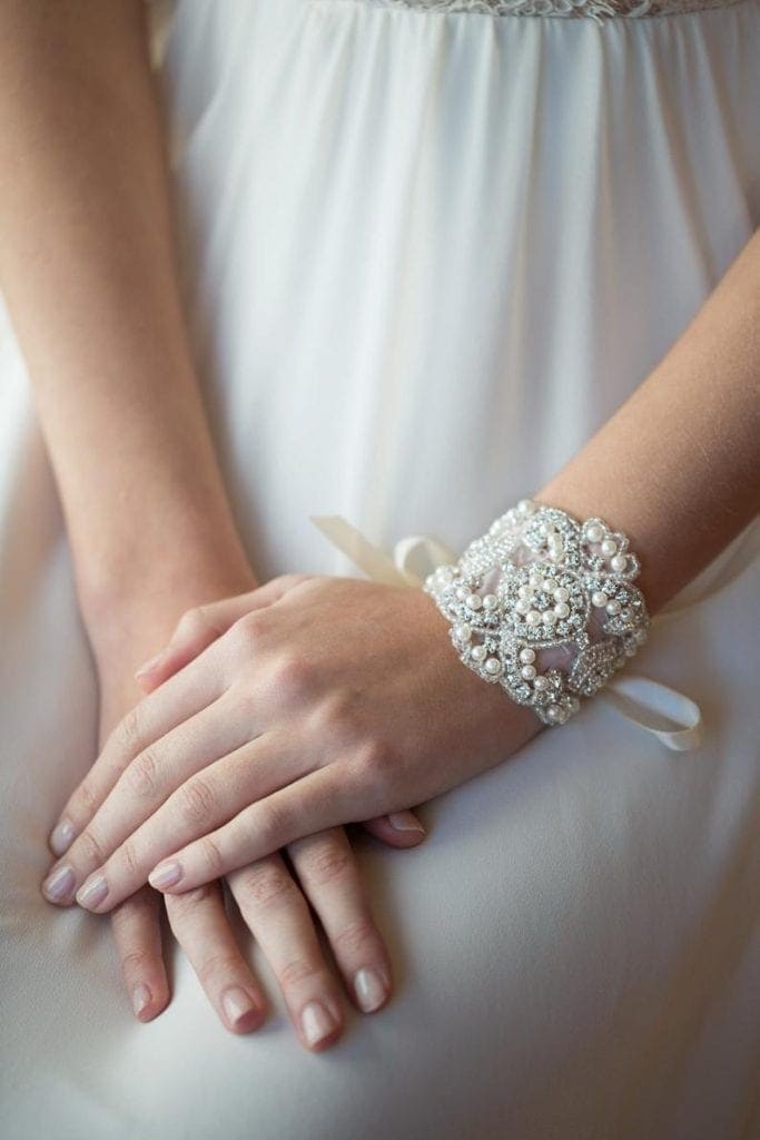 Girl wearing pearl cuff bracelet