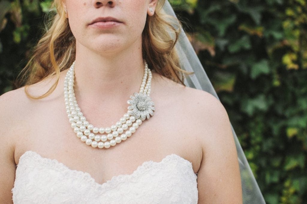 Bride wearing three layer choker for strapless dress